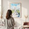 Framed Washington DC Watercolor Wall Art - In Living Room with Woman Looking at it - Portrait