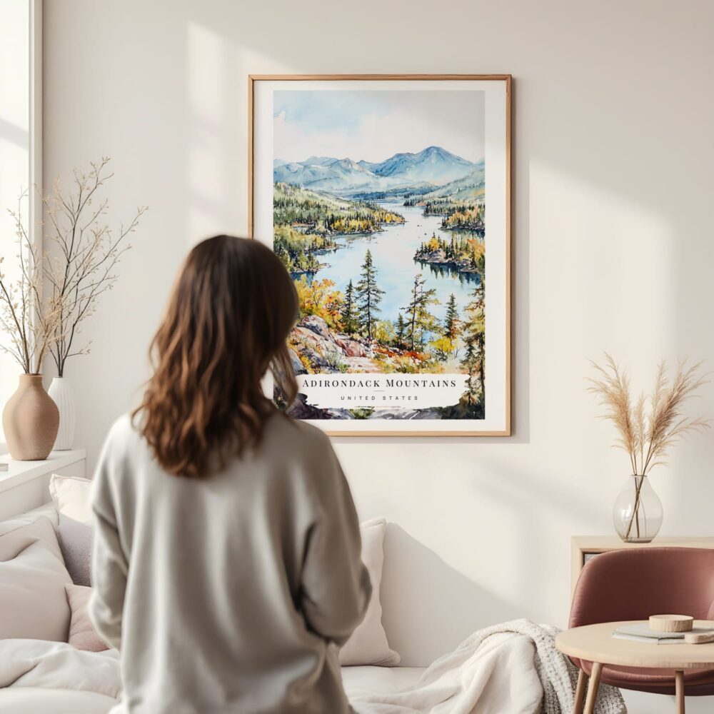 Framed Adirondack Mountains Watercolor Wall Art - In Living Room with Woman Looking at it - Portrait Framed Adirondack Mountains Watercolor Wall Art - In Living Room with Woman Looking at it - Portrait