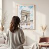 Framed Arc De Triomphe Watercolor Wall Art - In Living Room with Woman Looking at it - Portrait