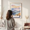 Framed Blue Ridge Mountains Watercolor Wall Art - In Living Room with Woman Looking at it - Portrait