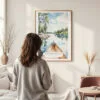 Framed Boundary Waters Minnesota Watercolor Wall Art - In Living Room with Woman Looking at it - Portrait