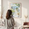 Framed Cape Cod Provincetown Watercolor Wall Art - In Living Room with Woman Looking at it - Portrait