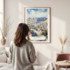 Framed Cape Town Watercolor Wall Art - In Living Room with Woman Looking at it - Portrait