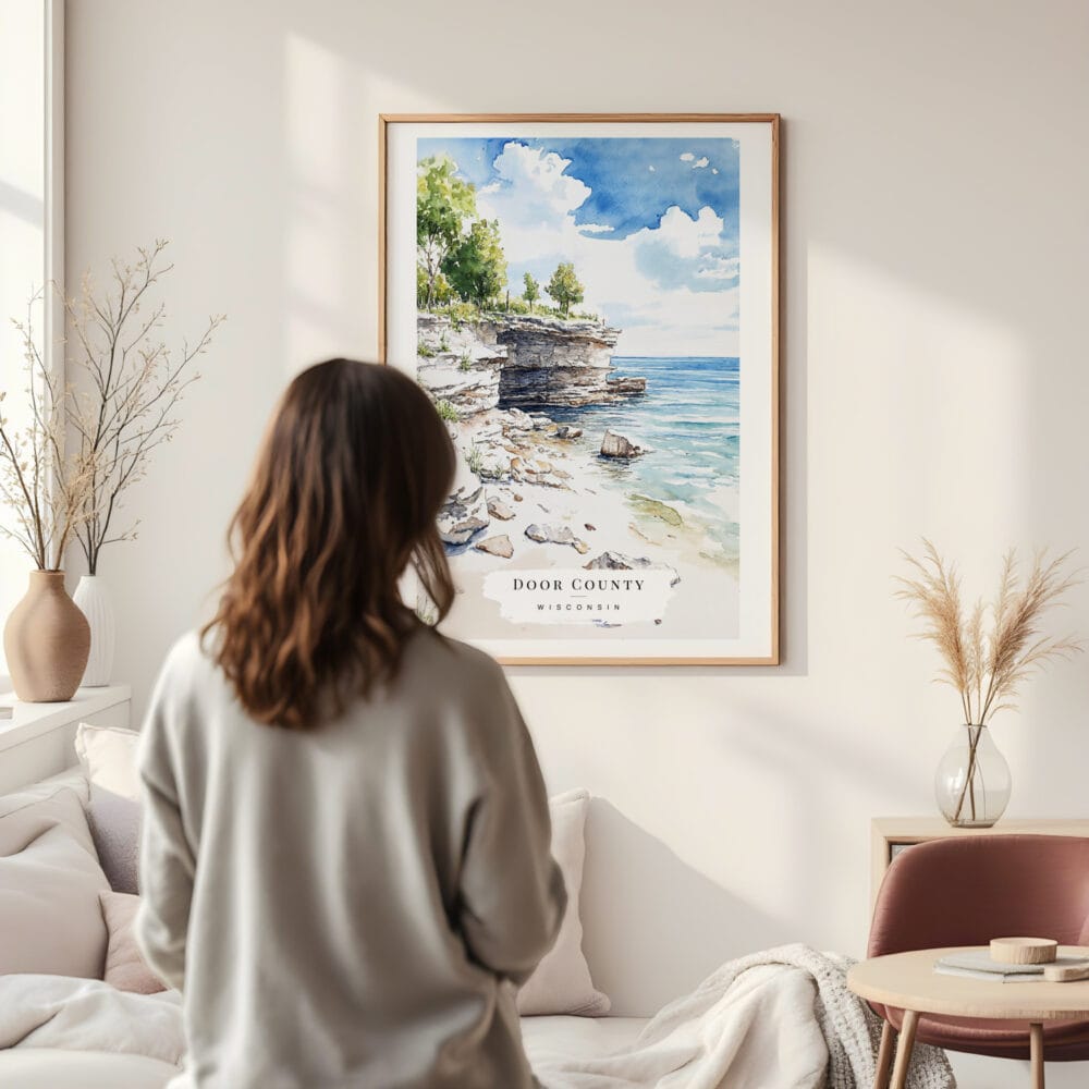 Framed Door County Wisconsin Watercolor Wall Art - In Living Room with Woman Looking at it - Portrait Framed Door County Wisconsin Watercolor Wall Art - In Living Room with Woman Looking at it - Portrait