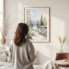 Framed Fairbanks Alaska Nature Watercolor Wall Art - In Living Room with Woman Looking at it - Portrait