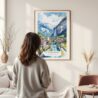 Framed Lauterbrunnen Watercolor Wall Art - In Living Room with Woman Looking at it - Portrait