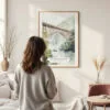 Framed New River Gorge Bridge Watercolor Wall Art - In Living Room with Woman Looking at it - Portrait