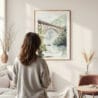 Framed New River Gorge Bridge Watercolor Wall Art - In Living Room with Woman Looking at it - Portrait