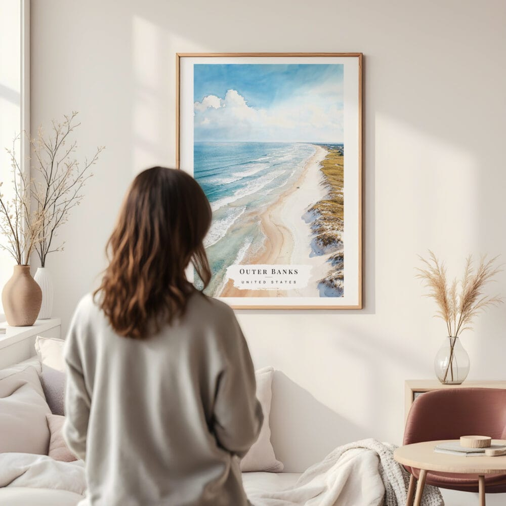 Framed Outer Banks NC Watercolor Wall Art - In Living Room with Woman Looking at it - Portrait Framed Outer Banks NC Watercolor Wall Art - In Living Room with Woman Looking at it - Portrait