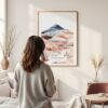 Framed Painted Hills Oregon Watercolor Wall Art - In Living Room with Woman Looking at it - Portrait