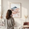 Framed Painted Hills Oregon Watercolor Wall Art - In Living Room with Woman Looking at it - Portrait