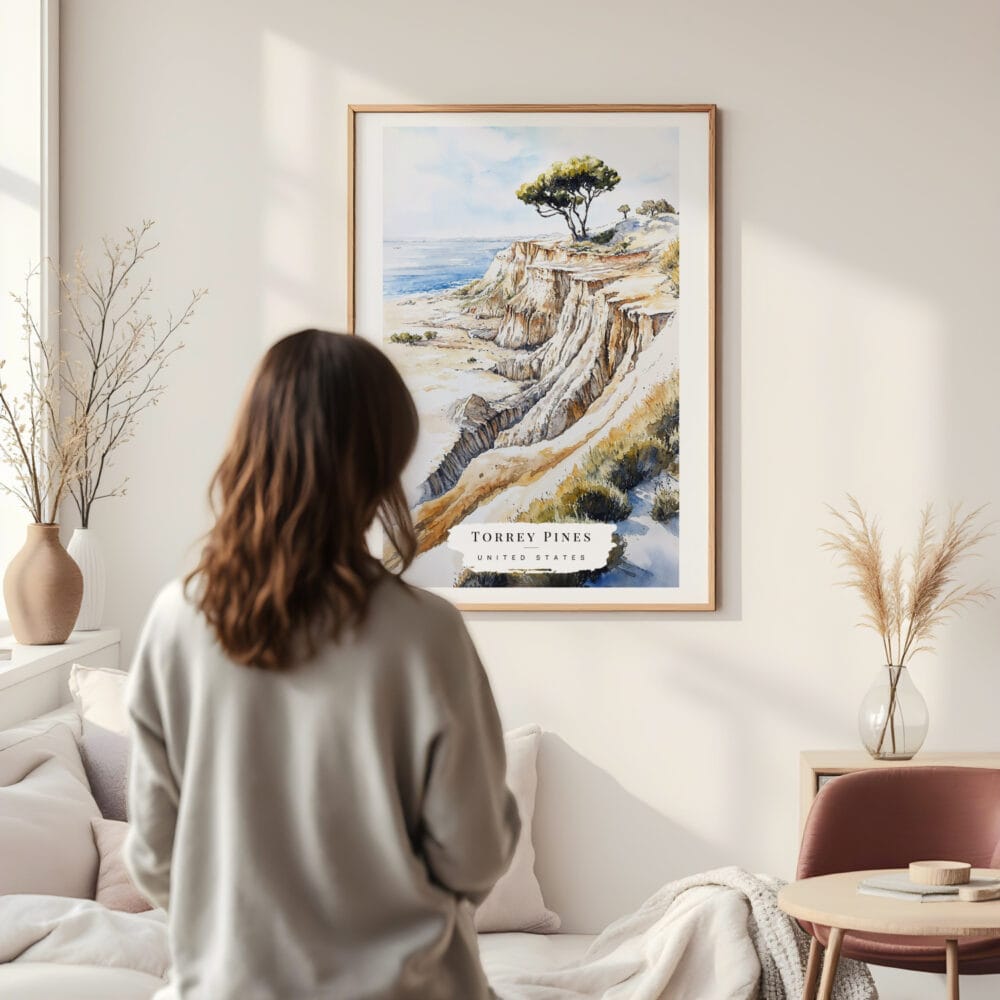 Framed Torrey Pines San Diego Watercolor Wall Art - In Living Room with Woman Looking at it - Portrait Framed Torrey Pines San Diego Watercolor Wall Art - In Living Room with Woman Looking at it - Portrait