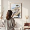 Framed Torrey Pines San Diego Watercolor Wall Art - In Living Room with Woman Looking at it - Portrait