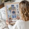 Woman Holding Framed Lisbon Streets Watercolor Wall Art - Portrait