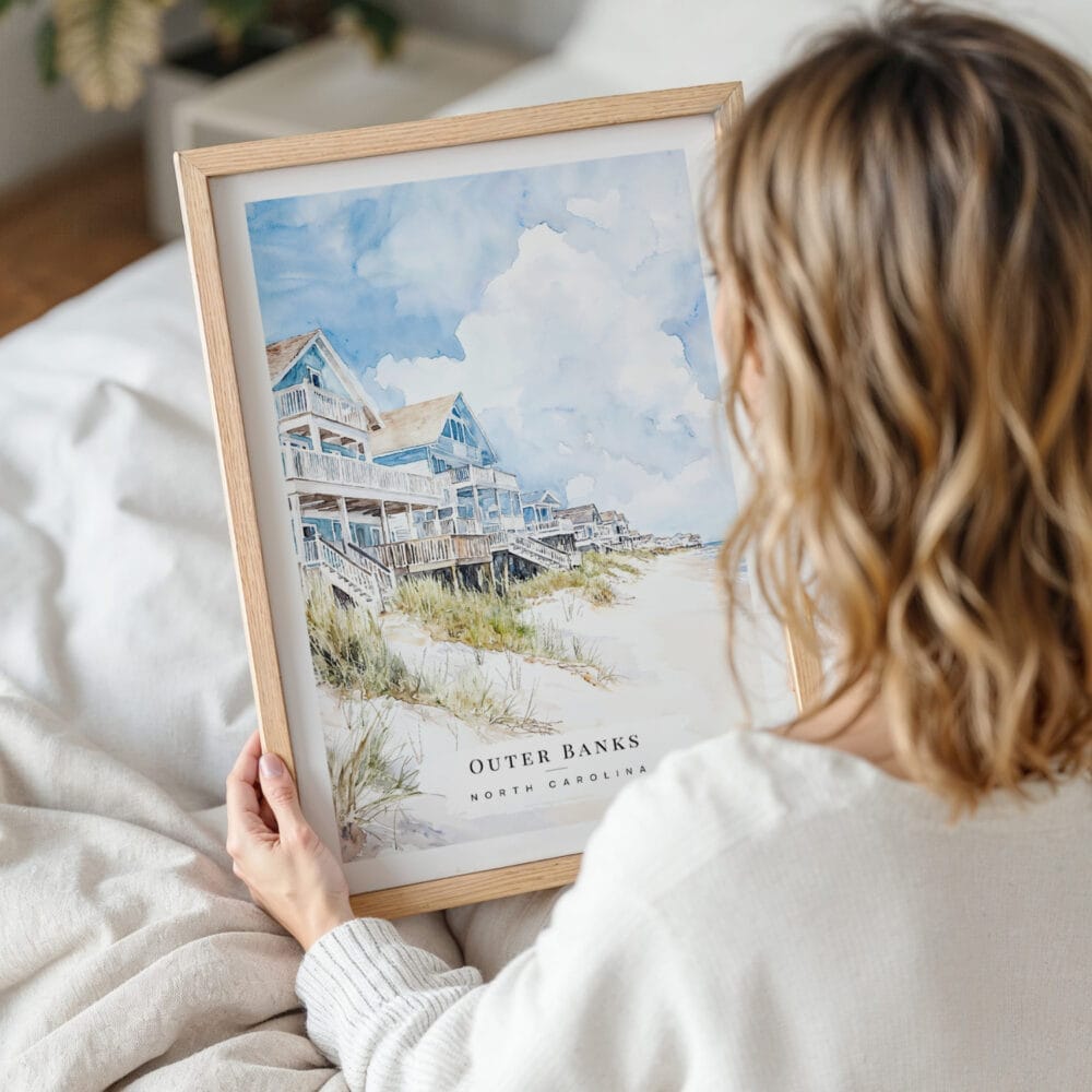 Woman Holding Framed Outer Banks Cottage Watercolor Wall Art - Portrait Woman Holding Framed Outer Banks Cottage Watercolor Wall Art - Portrait