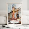 01 - Framed Chicago Theater Watercolor Wall Art leaning against couch - Portrait