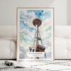 01 - Framed Seattle Space Needle Watercolor Wall Art leaning against couch - Portrait