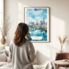 03 - Framed Austin Texas Watercolor Wall Art - In Living Room with Woman Looking at it - Portrait