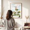 03 - Framed Balboa Park California Tower Watercolor Wall Art - In Living Room with Woman Looking at it - Portrait