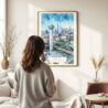 03 - Framed Dallas Texas Watercolor Wall Art - In Living Room with Woman Looking at it - Portrait