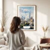 03 - Framed London The Shard Watercolor Wall Art - In Living Room with Woman Looking at it - Portrait