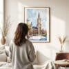 03 - Framed Munich Marienplatz Watercolor Wall Art - In Living Room with Woman Looking at it - Portrait