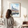 03 - Framed Nashville Skyline Watercolor Wall Art - In Living Room with Woman Looking at it - Portrait