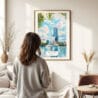 03 - Framed Orlando Florida Watercolor Wall Art - In Living Room with Woman Looking at it - Portrait