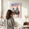 03 - Framed San Diego Skyline Watercolor Wall Art - In Living Room with Woman Looking at it - Portrait