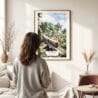 03 - Framed Sri Lanka Train Watercolor Wall Art - In Living Room with Woman Looking at it - Portrait