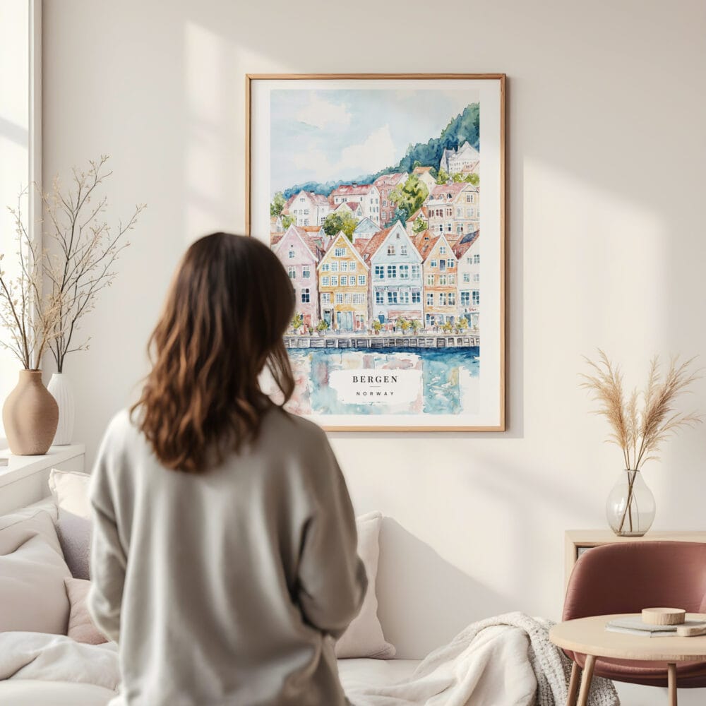 Framed Bergen Norway Houses Watercolor Wall Art - In Living Room with Woman Looking at it - Portrait Framed Bergen Norway Houses Watercolor Wall Art - In Living Room with Woman Looking at it - Portrait