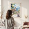 Framed Bogota Colombia Watercolor Wall Art - In Living Room with Woman Looking at it - Portrait