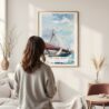 Framed Boston Zakim Bridge Watercolor Wall Art - In Living Room with Woman Looking at it - Portrait