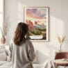 Framed Colorado Springs Watercolor Wall Art – In Living Room with Woman Looking at it – Portrait