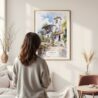 Framed Cordoba Spain Watercolor Wall Art - In Living Room with Woman Looking at it - Portrait