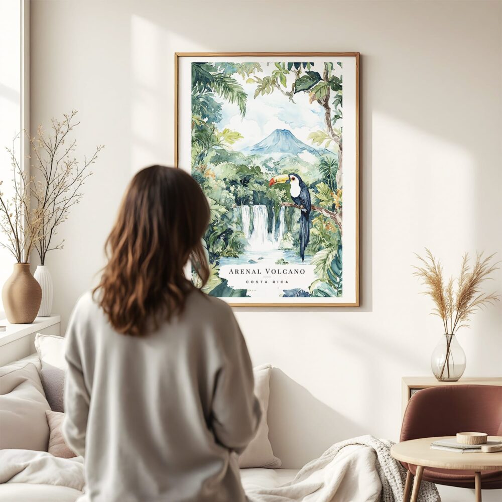 Framed Costa Rica Arenal Vulcano Watercolor Wall Art - In Living Room with Woman Looking at it - Portrait Framed Costa Rica Arenal Vulcano Watercolor Wall Art - In Living Room with Woman Looking at it - Portrait