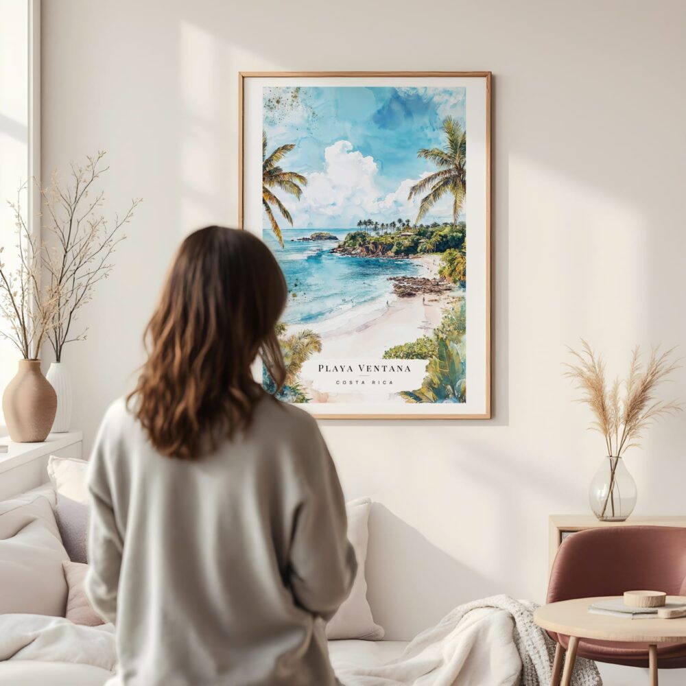 Framed Costa Rica Playa Ventana Watercolor Wall Art - In Living Room with Woman Looking at it - Portrait Framed Costa Rica Playa Ventana Watercolor Wall Art - In Living Room with Woman Looking at it - Portrait