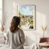 Framed Cotswolds Watercolor Wall Art - In Living Room with Woman Looking at it - Portrait
