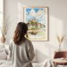 Framed France Mont Saint Michel Watercolor Wall Art - In Living Room with Woman Looking at it - Portrait