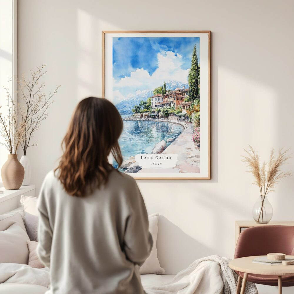 Framed Lake Garda Italy Watercolor Wall Art - In Living Room with Woman Looking at it - Portrait Framed Lake Garda Italy Watercolor Wall Art - In Living Room with Woman Looking at it - Portrait