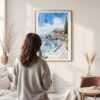 Framed Lake Garda Italy Watercolor Wall Art - In Living Room with Woman Looking at it - Portrait
