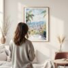 Framed Medellin Colombia Watercolor Wall Art - In Living Room with Woman Looking at it - Portrait