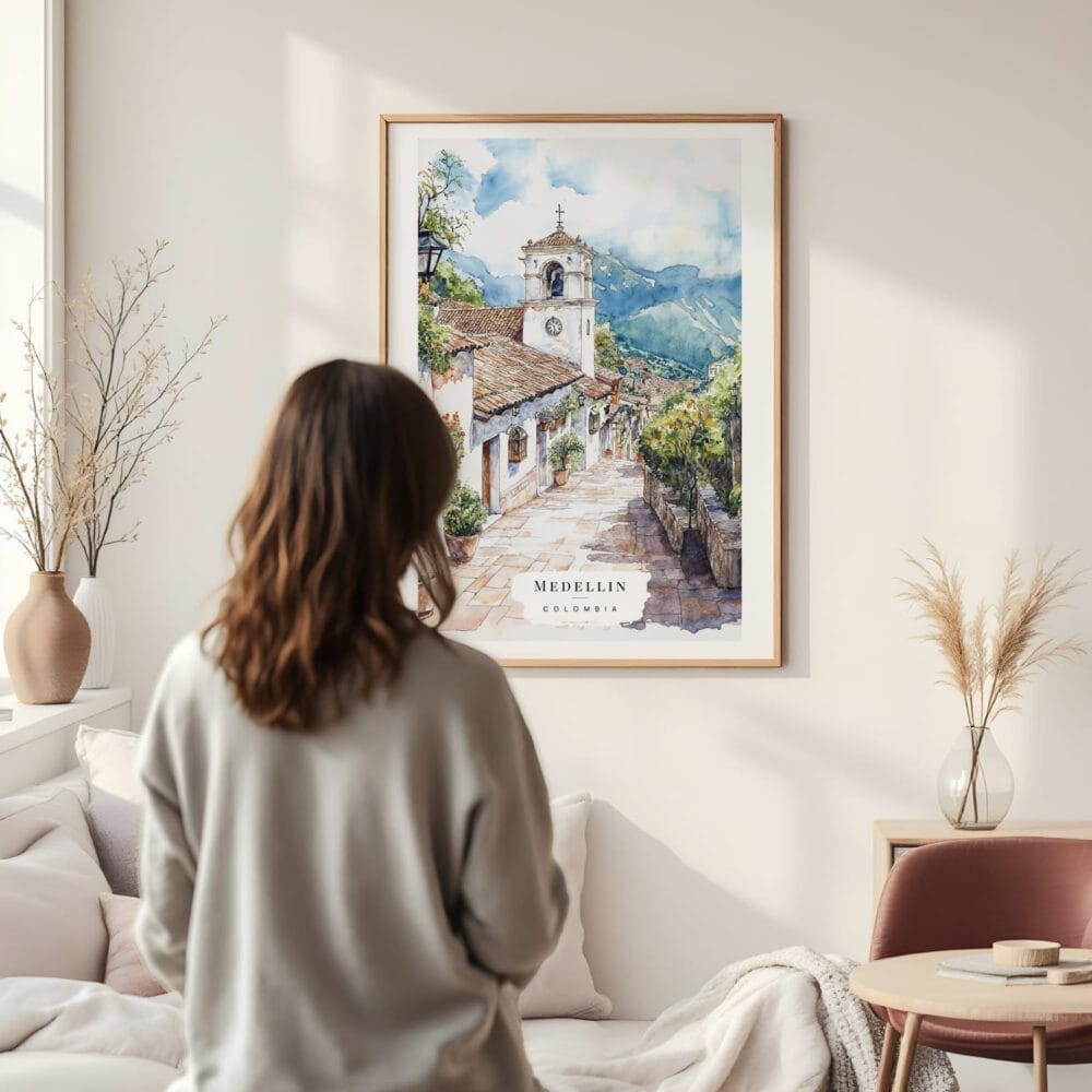 Framed Medellin Old Town Watercolor Wall Art - In Living Room with Woman Looking at it - Portrait Framed Medellin Old Town Watercolor Wall Art - In Living Room with Woman Looking at it - Portrait