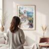 Framed Medellin Old Town Watercolor Wall Art - In Living Room with Woman Looking at it - Portrait