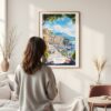 Framed Naples Italy Watercolor Wall Art - In Living Room with Woman Looking at it - Portrait
