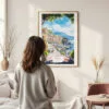Framed Naples Italy Watercolor Wall Art - In Living Room with Woman Looking at it - Portrait