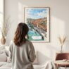 Framed Porto Skyline Watercolor Wall Art - In Living Room with Woman Looking at it - Portrait
