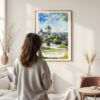 Framed Quebec Château Frontenac Watercolor Wall Art - In Living Room with Woman Looking at it - Portrait