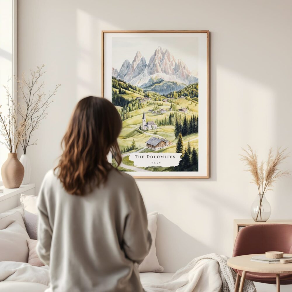 Framed The Dolomites Watercolor Wall Art - In Living Room with Woman Looking at it - Portrait Framed The Dolomites Watercolor Wall Art - In Living Room with Woman Looking at it - Portrait