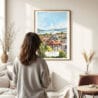 03 - Framed Geneva Switzerland Watercolor Wall Art - In Living Room with Woman Looking at it - Portrait.jpg